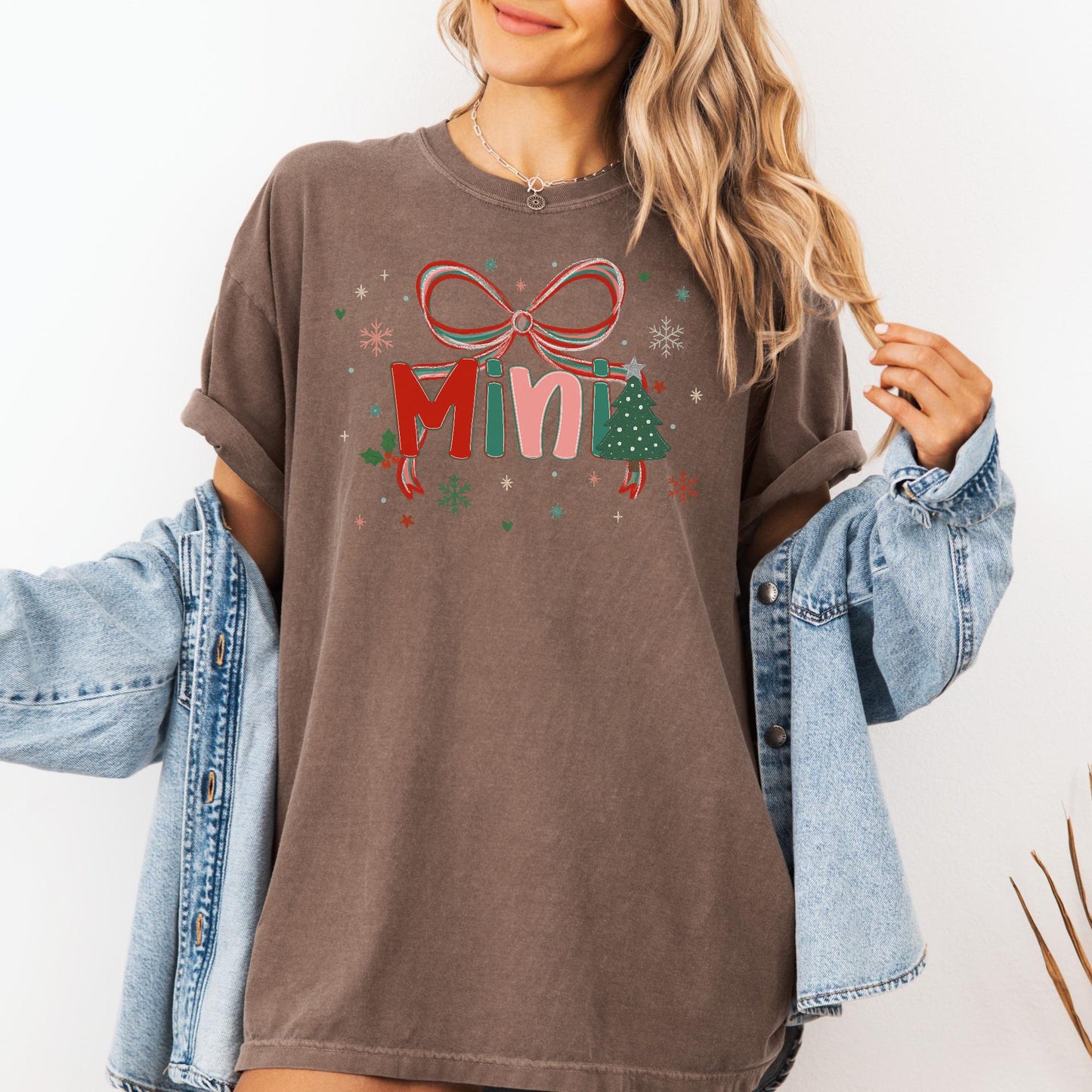 Woman wearing brown oversized Custom Preppy Christmas Family Shirt with Mini bow and tree graphic