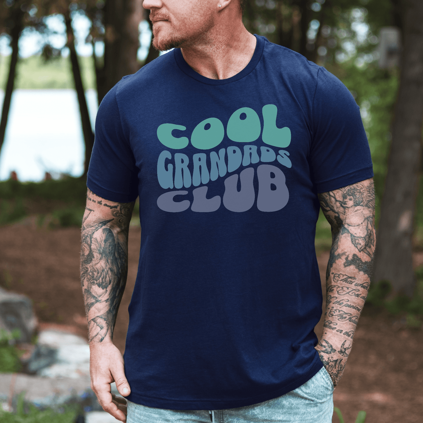 Maddy and George Designs Retro Cool Grandads Club Shirt navy tee worn by tattooed man outdoors
