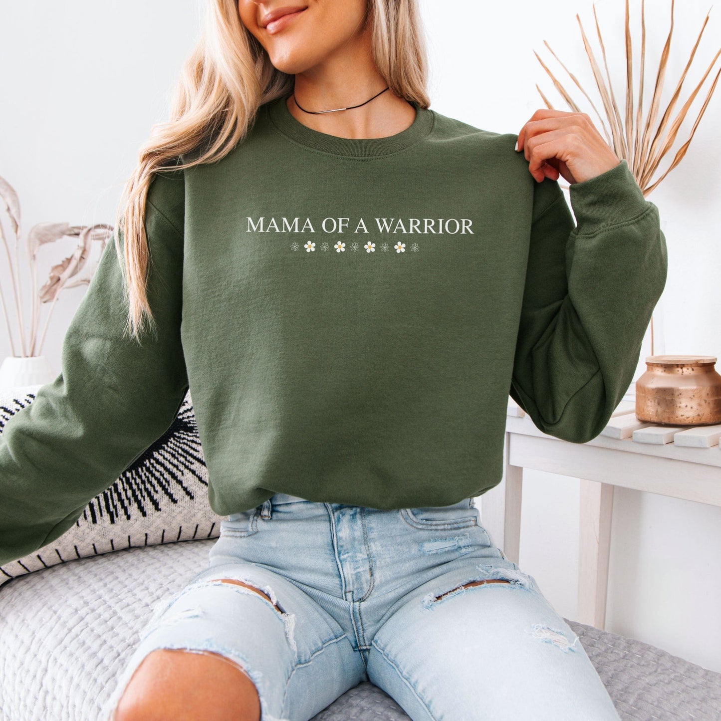 Olive crewneck Mama of a Warrior Sweatshirt by Maddy and George Designs on model wearing ripped jeans