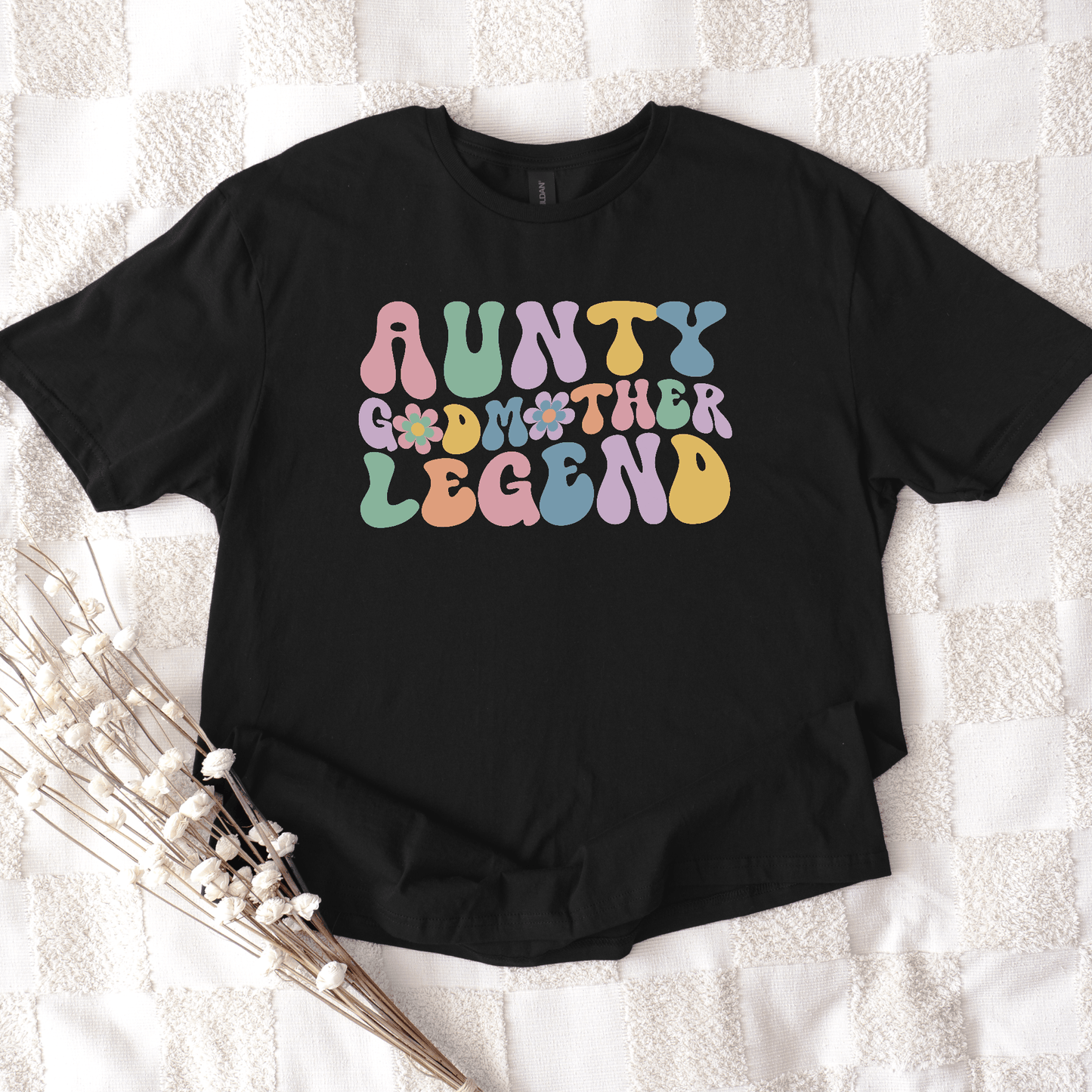 Black cotton t shirt by Maddy and George Designs with retro pastel print reading aunty godmother legend shirt ideal gift