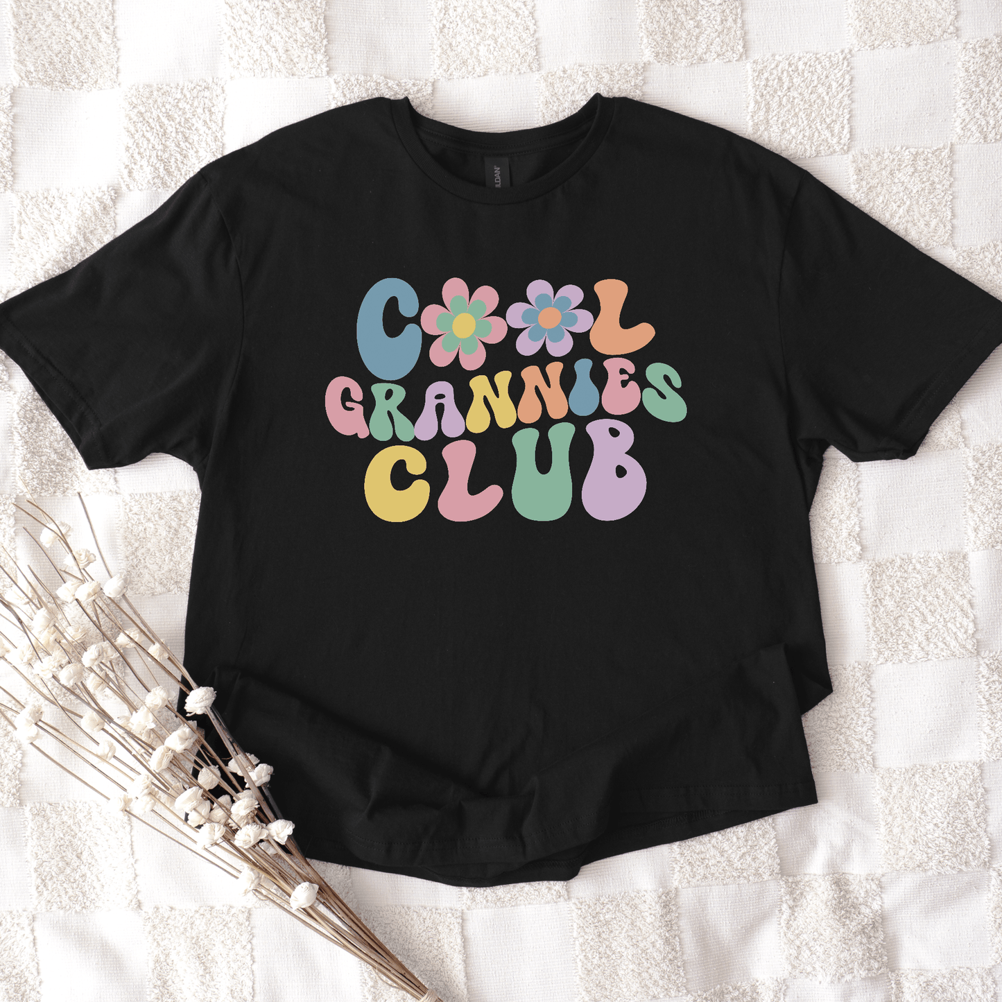 Cool Grannies Club Shirt black tee with pastel retro flower and bubble lettering by Maddy and George Designs