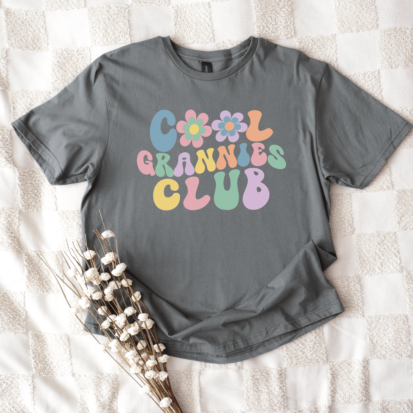 Cool Grannies Club Shirt grey tee with pastel retro bubble letters and floral accents flat lay by Maddy and George Designs