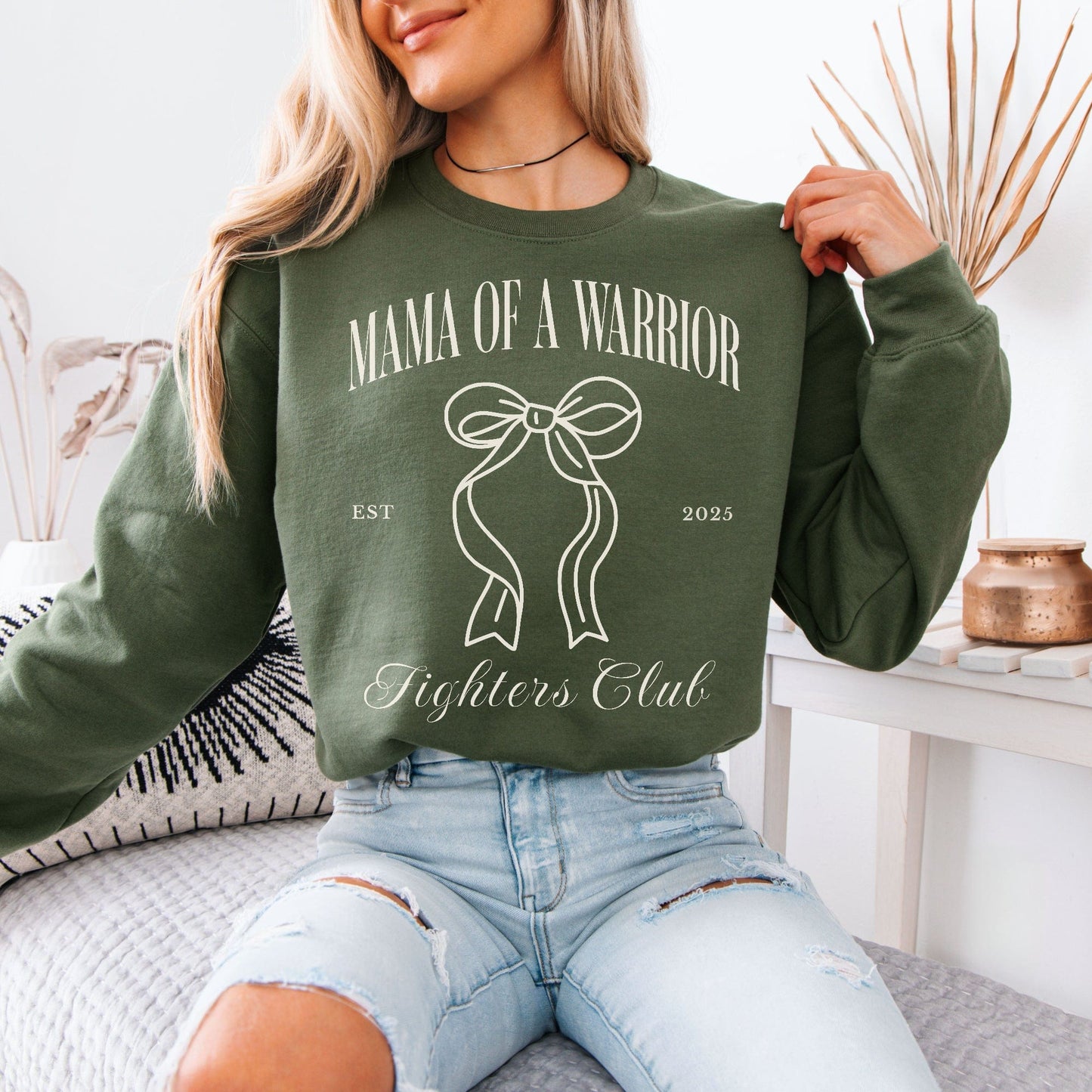 Maddy and George Designs Medical Mom Gift olive crewneck sweatshirt with Mama of a Warrior ribbon design