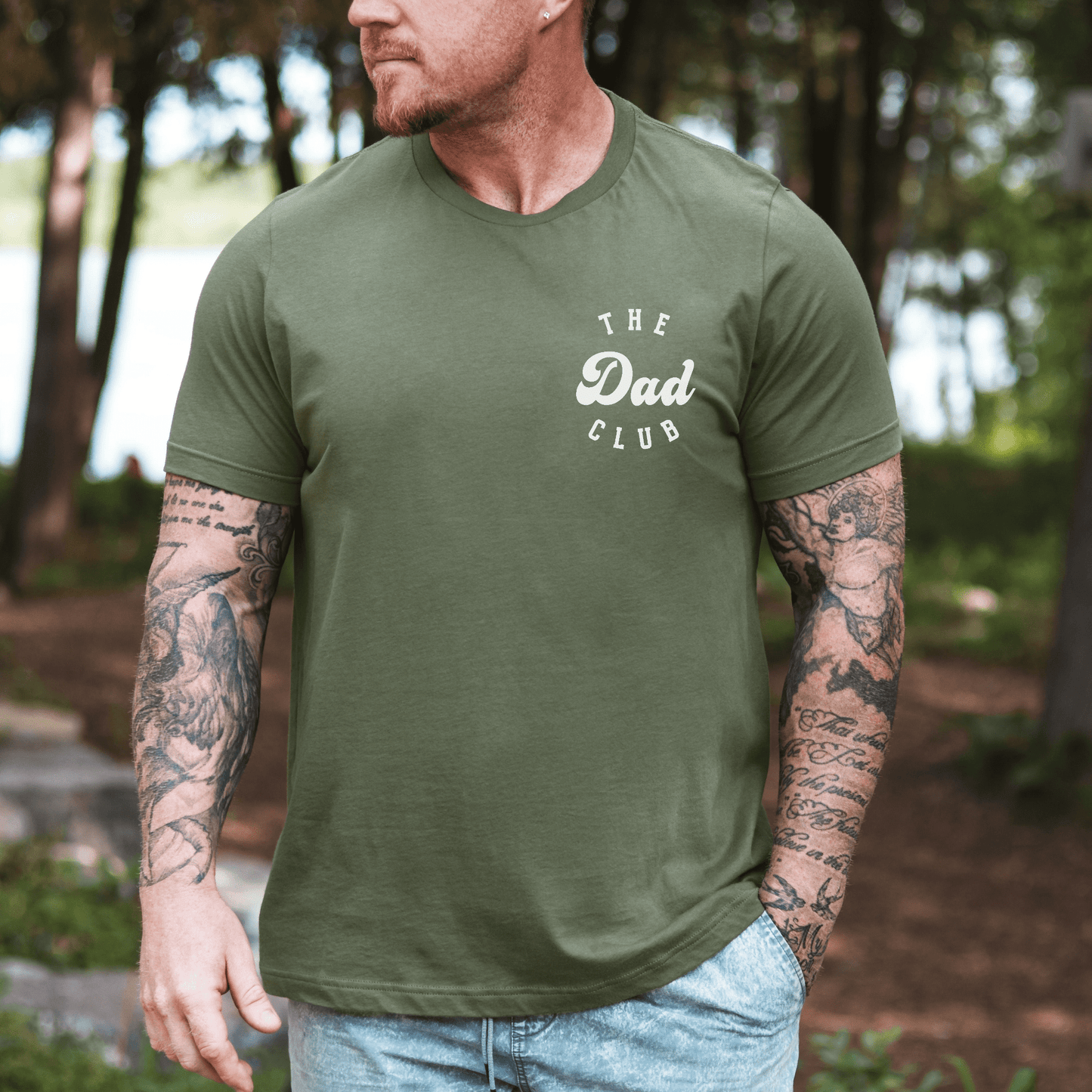 Cool Dads Club Shirt by Maddy and George Designs olive green t shirt with small chest logo worn outdoors