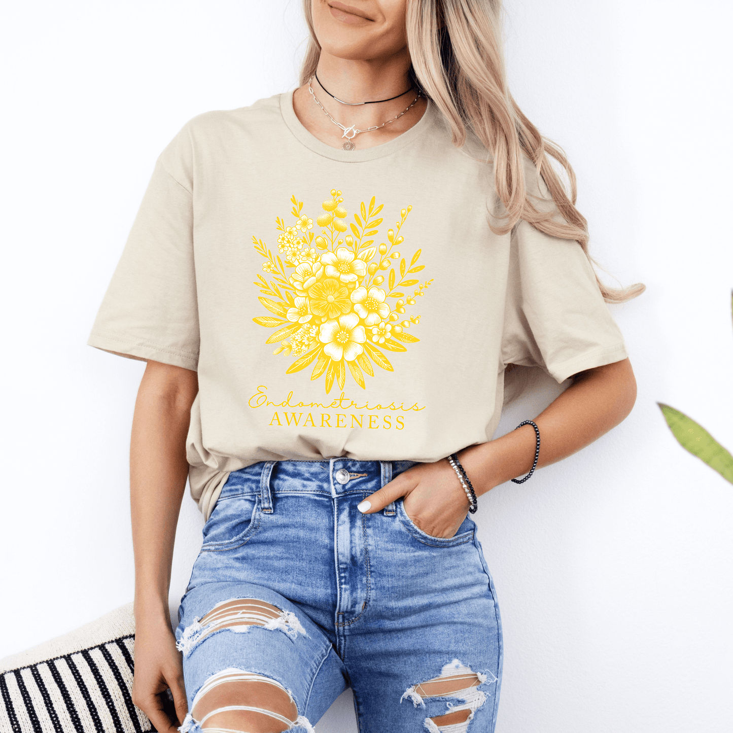 Floral Endometriosis Awareness Shirt | Gift For Endo Warrior. Beige tee with yellow floral graphic by Maddy & George Designs