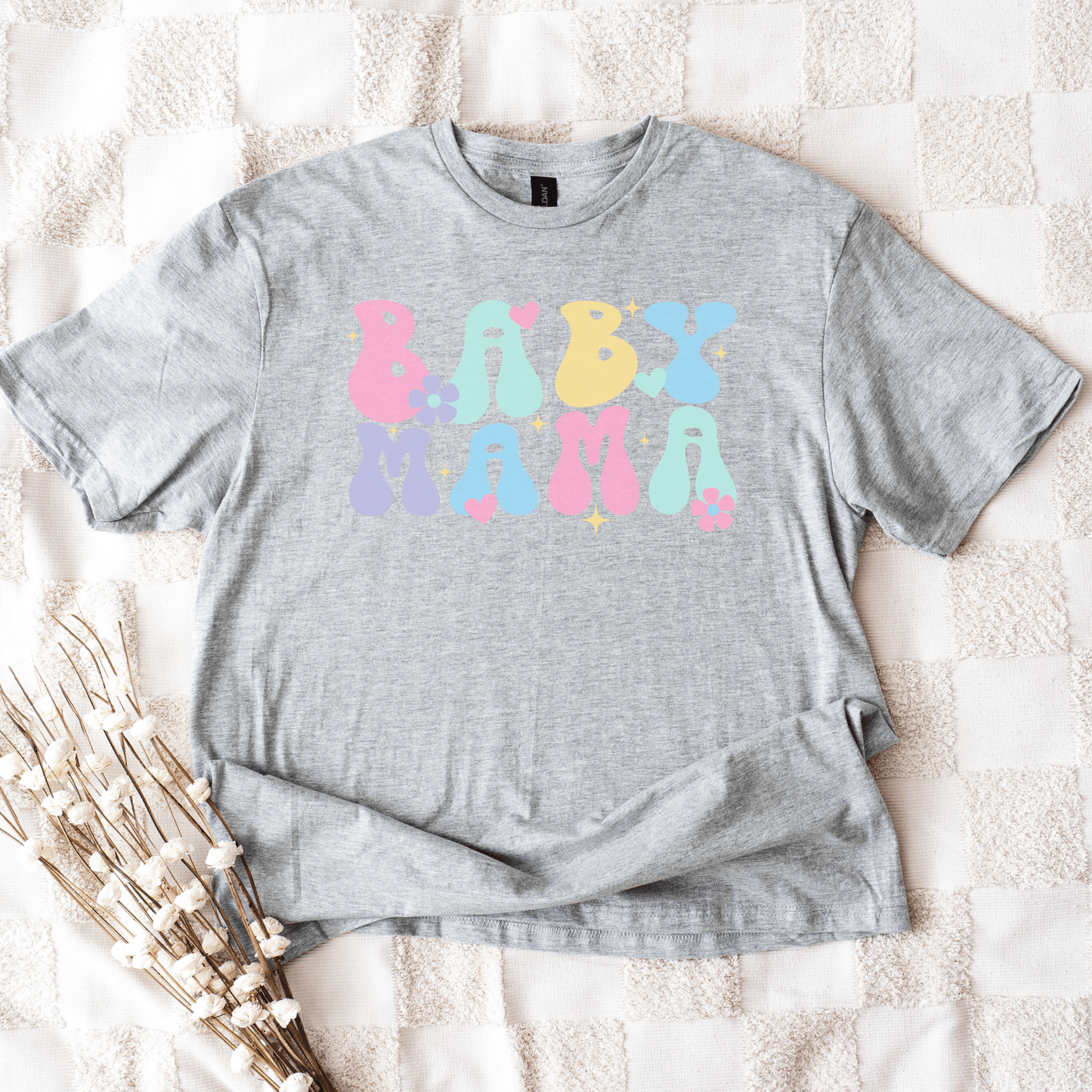 Cute Baby Mama Shirt gray unisex tee with pastel bubble letters and hearts and flowers styled flatlay by Maddy and George Designs