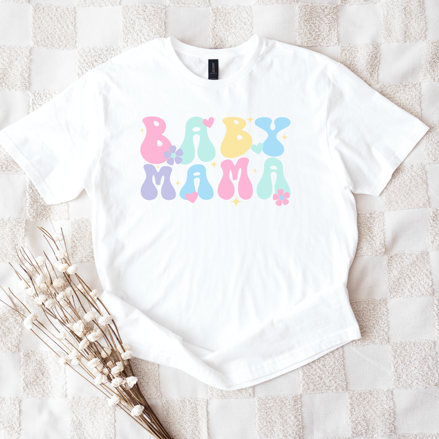 White tee with pastel retro bubble letters reading BABY MAMA on textured blanket Cute Baby Mama Shirt