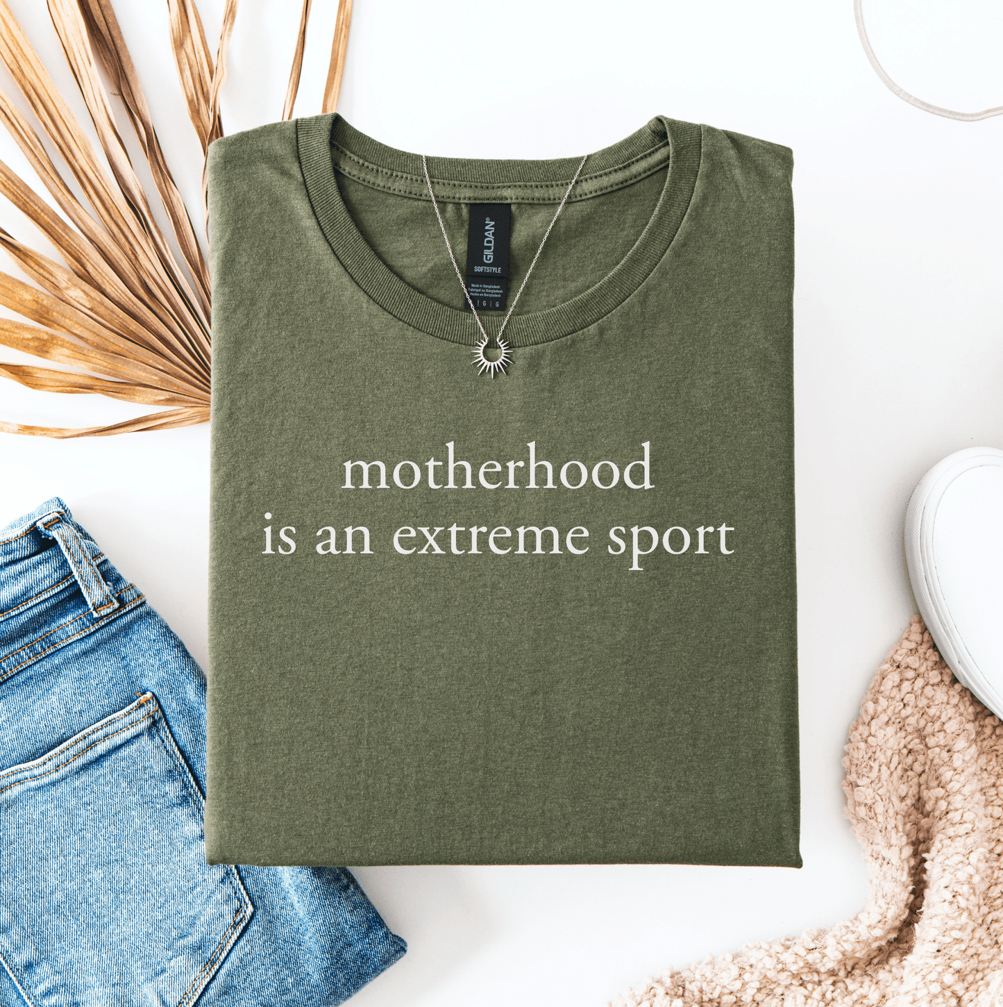 Funny Mum Life Tee olive green shirt with motherhood is an extreme sport white print necklace styled with jeans and sneakers