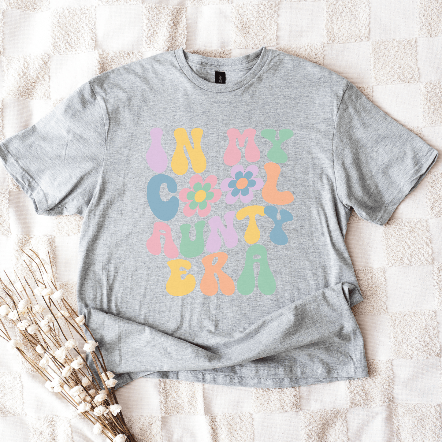 In My Cool Aunty Era Shirt gray tee with pastel retro bubble letters and flower graphic by Maddy and George Designs