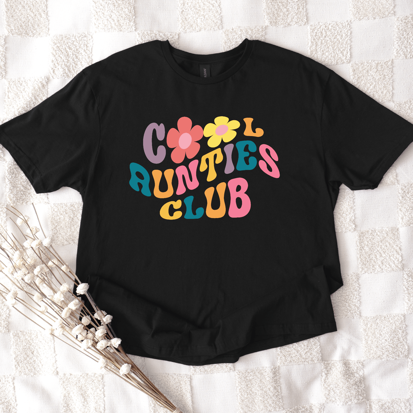 Retro Cool Aunties Club Shirt black tee with colorful retro flower graphic by Maddy and George Designs