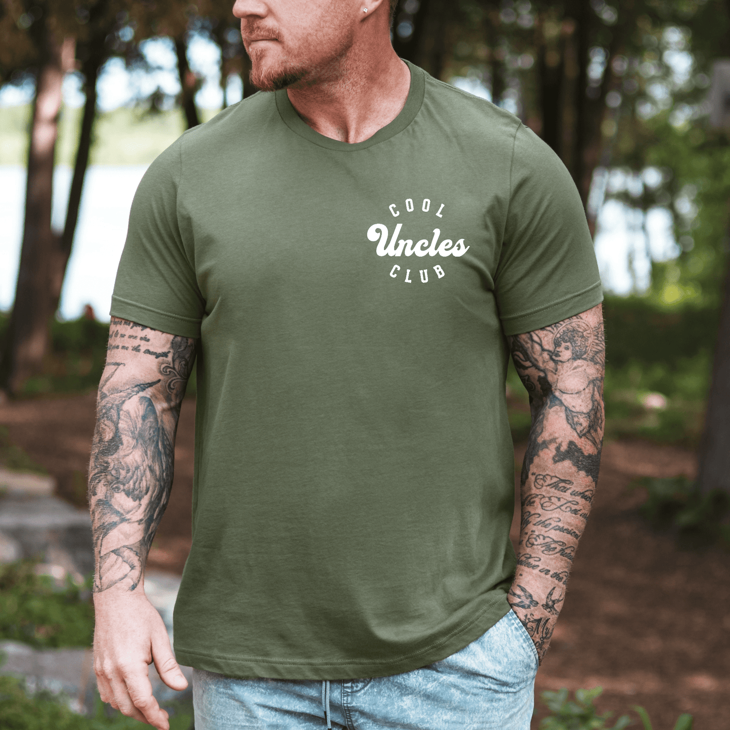 Maddy and George Designs Cool Uncles Club Shirt olive green unisex tee with small white chest logo outdoors