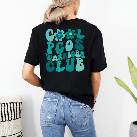 Maddy and George Designs PCOS Awareness Shirt black tee with teal retro Cool PCOS Warriors Club print on back
