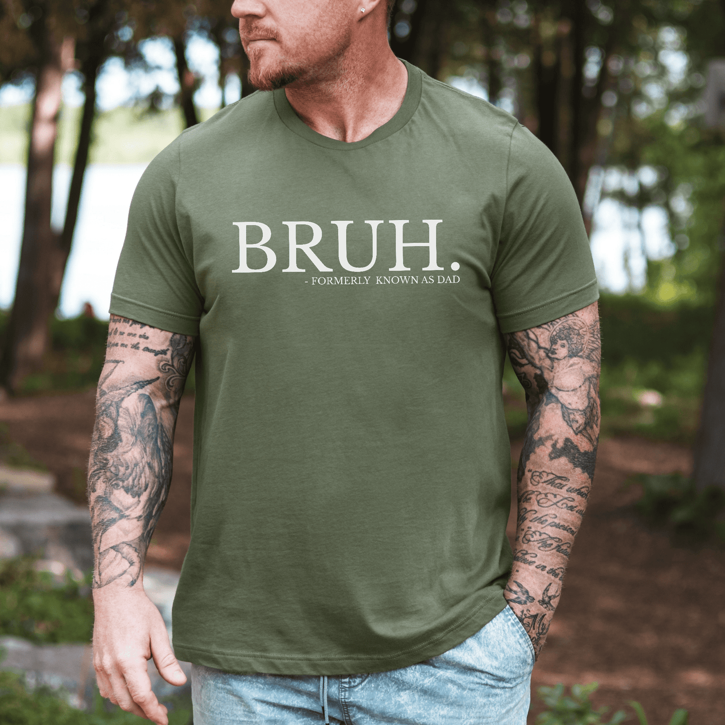 Maddy and George Designs BRUH Formally Known As Dad Shirt . Olive green mens tee with white print worn outdoors