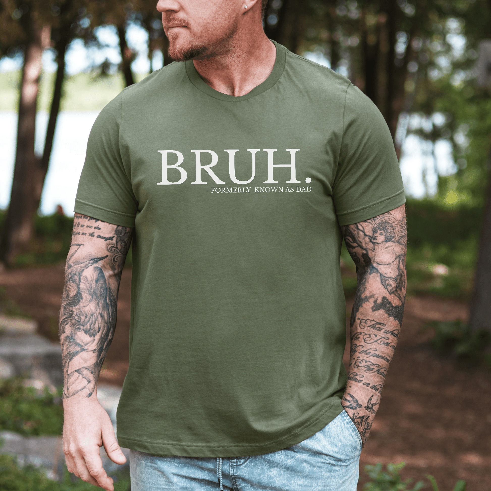 Maddy and George Designs BRUH Formally Known As Dad Shirt . Olive green mens tee with white print worn outdoors