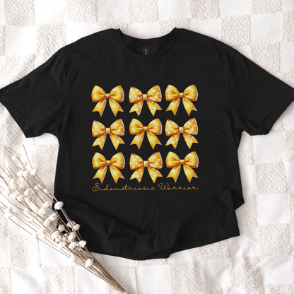 Coquette Endometriosis Awareness Shirt black tee with nine yellow bows and Endometriosis Warrior script