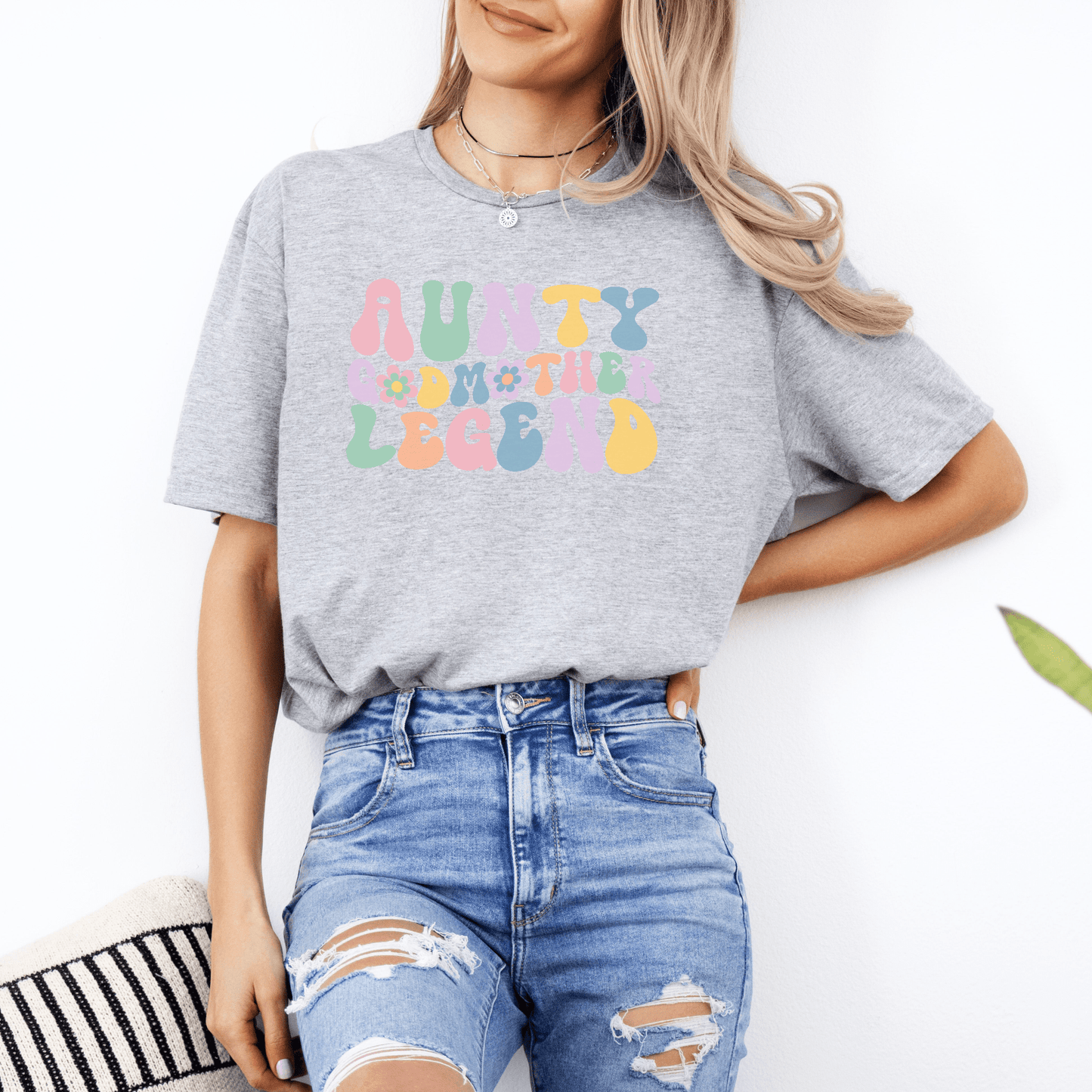 Woman wearing gray aunty godmother legend shirt with pastel retro lettering casual gift tee from Maddy and George Designs