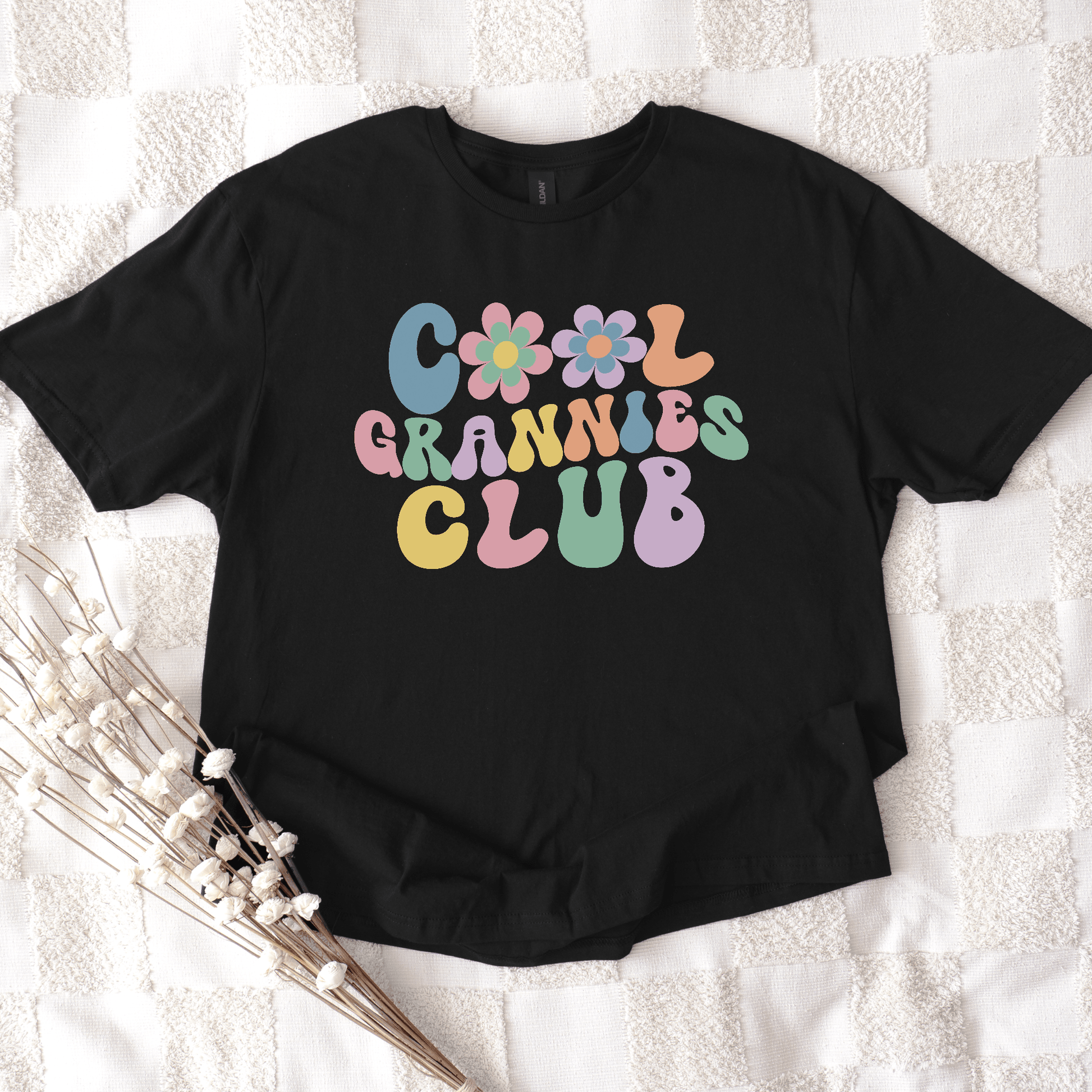 Cool Grannies Club Shirt black tee with pastel retro flower and bubble lettering by Maddy and George Designs