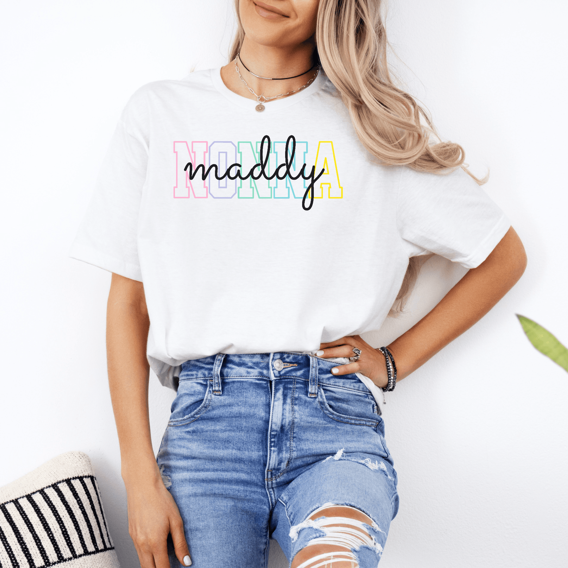 Woman wearing white Custom Nonna Shirt with pastel block Nonna letters and cursive maddy name print
