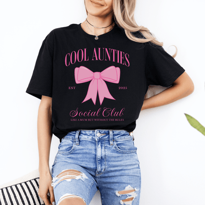 Custom Cool Aunties Club Shirt by Maddy and George Designs black tee with pink bow graphic and casual distressed jeans styling