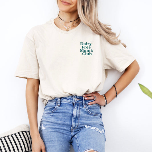 Woman wearing cream CMPA Awareness Tee by Maddy and George Designs with Dairy Free Mums Club chest print and distressed jeans