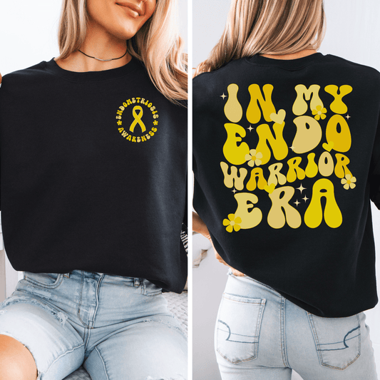 Black Maddy and George Designs sweatshirt with yellow ribbon and bold back print In My Endo Warrior Era Sweatshirt