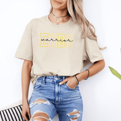 Woman wearing beige Endometriosis Awareness Shirt | Gift For Endo Warrior with yellow ENDO graphic and distressed jeans