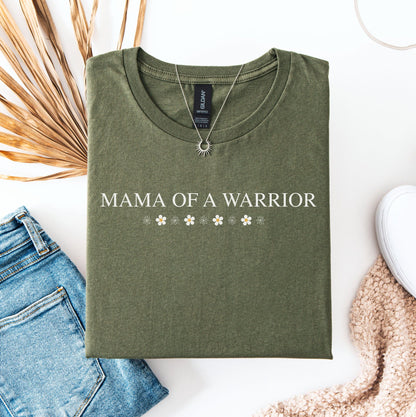 Mama Of A Warrior Shirt olive green folded tee with white lettering and floral accents styled with jeans