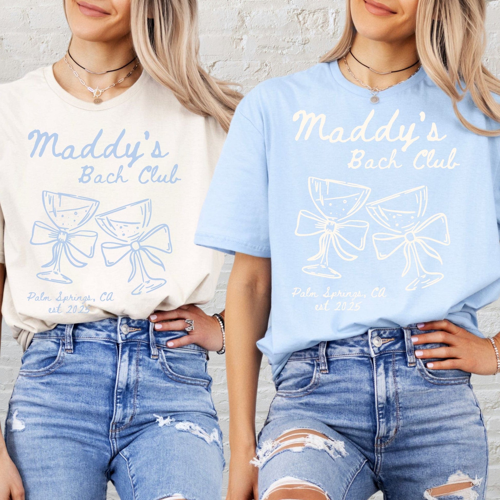 Personalised Bachelorette Party Tee in cream and light blue worn by two women featuring Maddy s Bach Club wine glass bow design