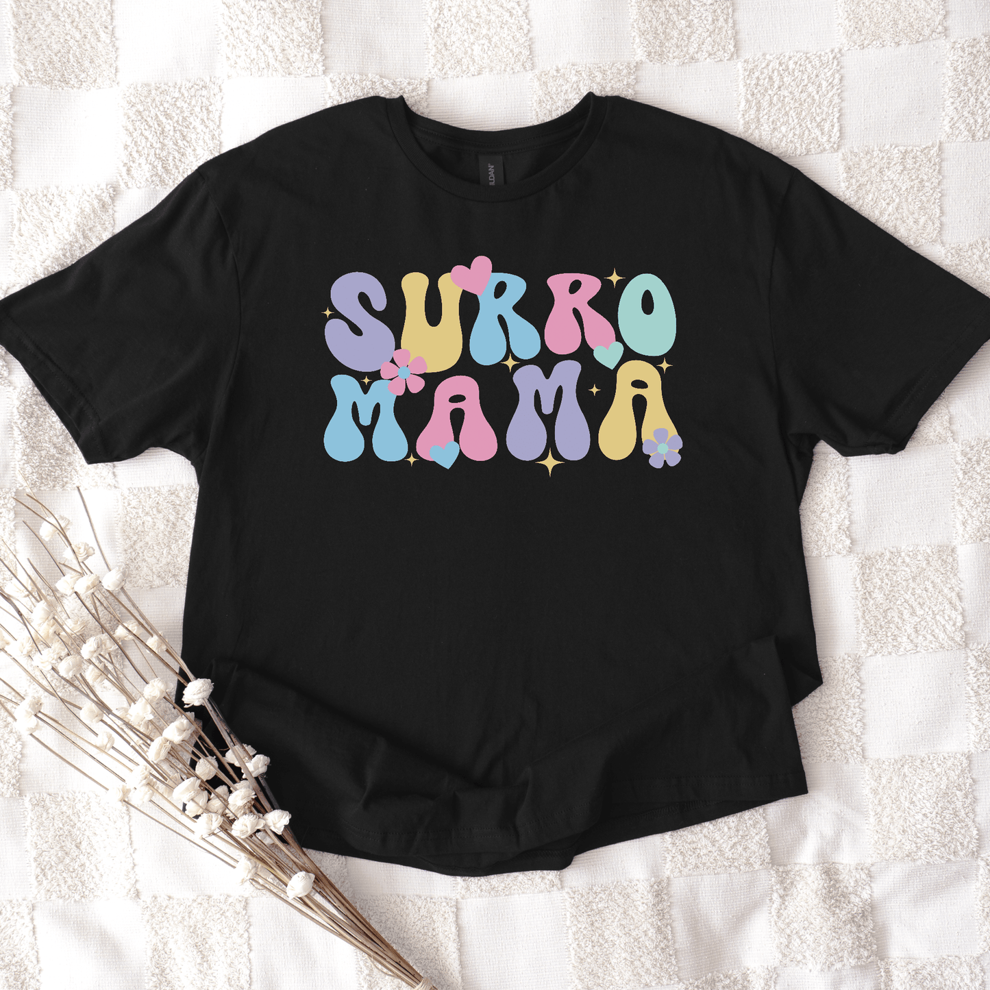 Cute Surrogate Mama Shirt black tee with pastel retro bubble letters and floral accents by Maddy and George Designs