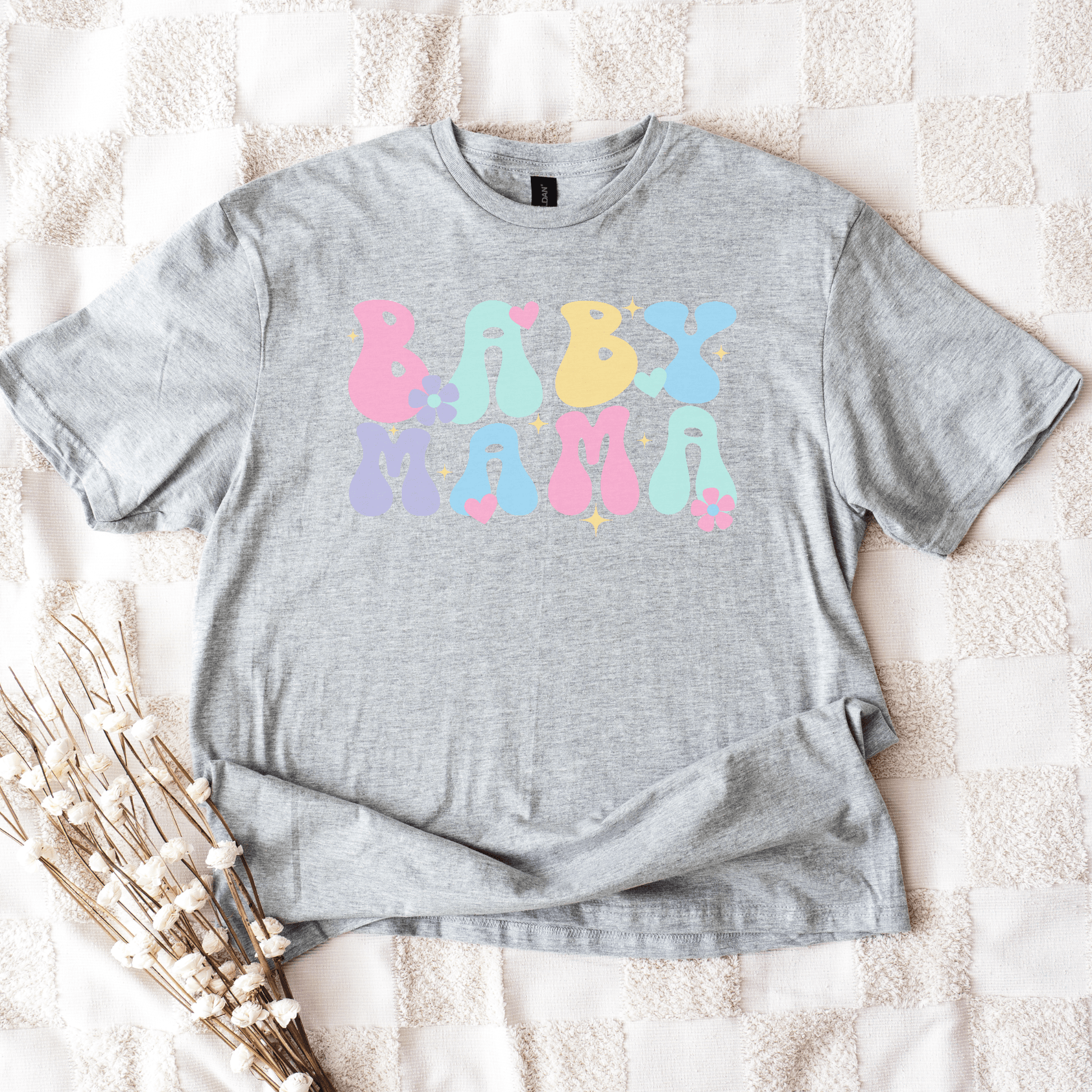 Cute Baby Mama Shirt gray unisex tee with pastel bubble letters and hearts and flowers styled flatlay by Maddy and George Designs