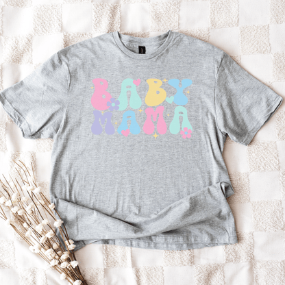 Cute Baby Mama Shirt gray unisex tee with pastel bubble letters and hearts and flowers styled flatlay by Maddy and George Designs