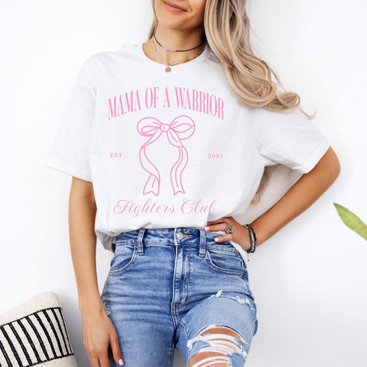 Woman wearing white t shirt with pink ribbon and text Mama of a Warrior Medical Mama Gift print by Maddy and George Designs