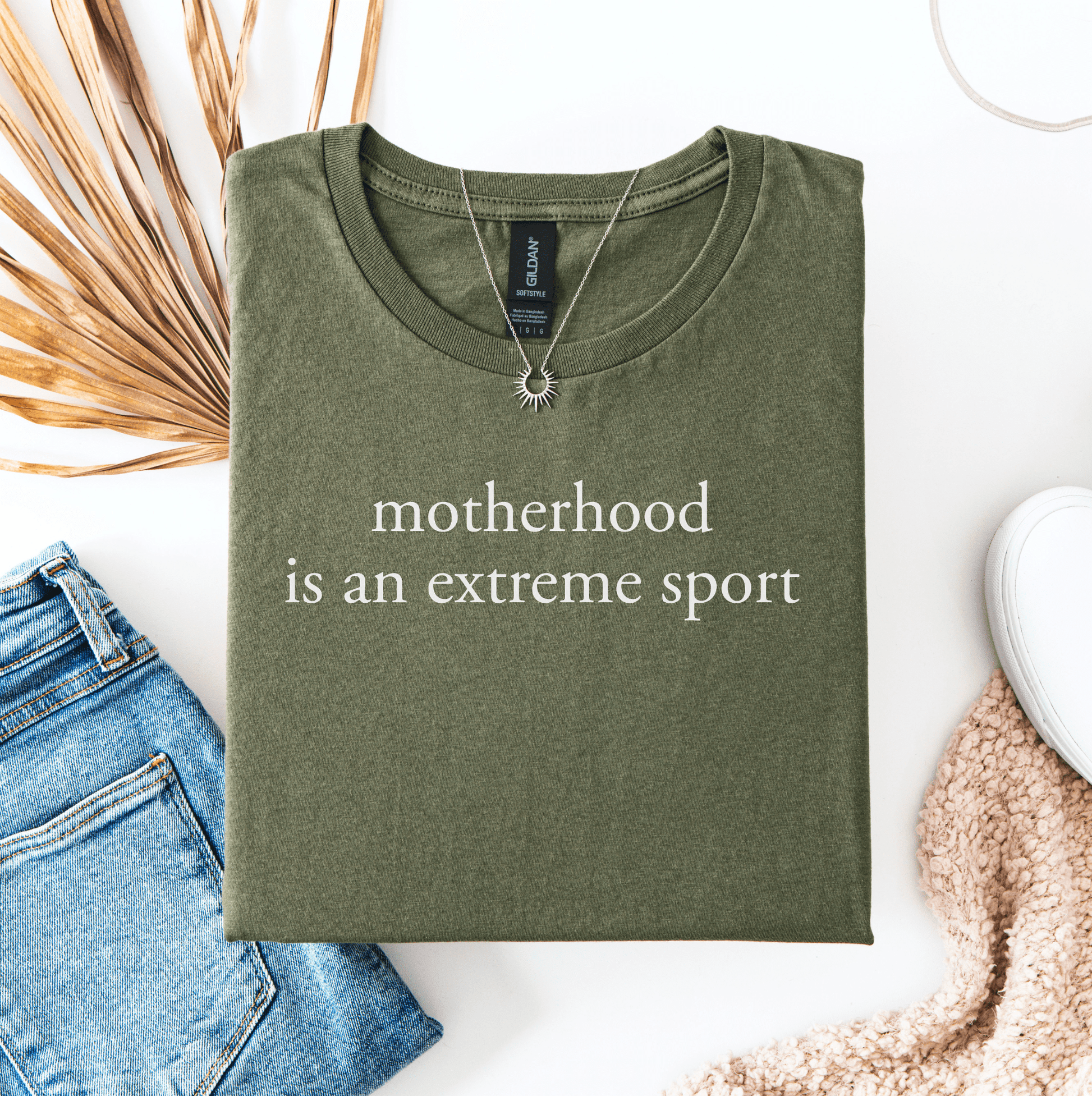 Funny Mum Life Tee olive green shirt with motherhood is an extreme sport white print necklace styled with jeans and sneakers