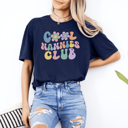 Woman wearing navy Cool Nannies Club Shirt with retro pastel flower bubble letters by Maddy and George Designs