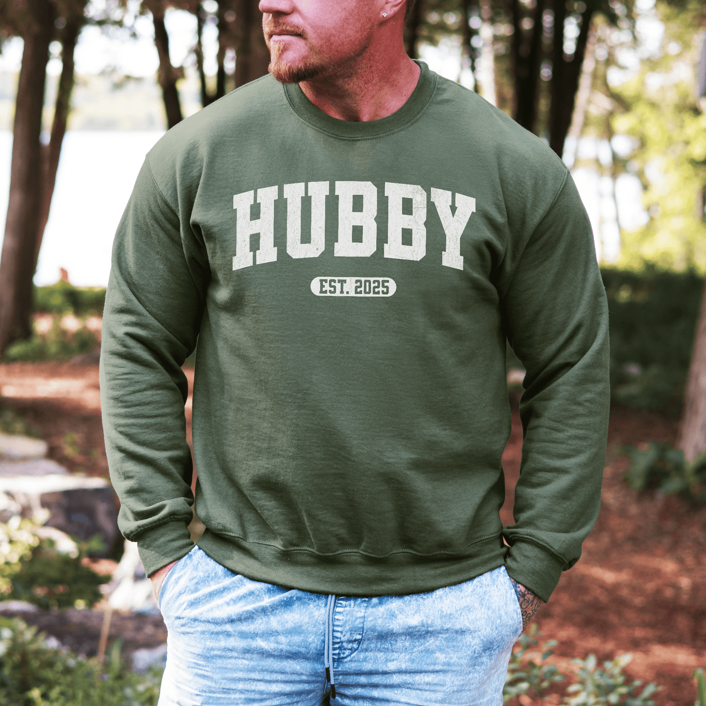 Maddy and George Designs Custom Hubby EST Year Sweatshirt olive green crewneck worn by man outdoors
