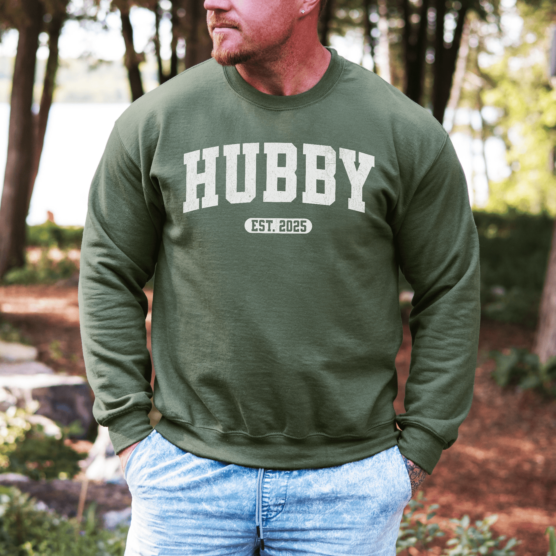 Maddy and George Designs Custom Hubby EST Year Sweatshirt olive green crewneck worn by man outdoors
