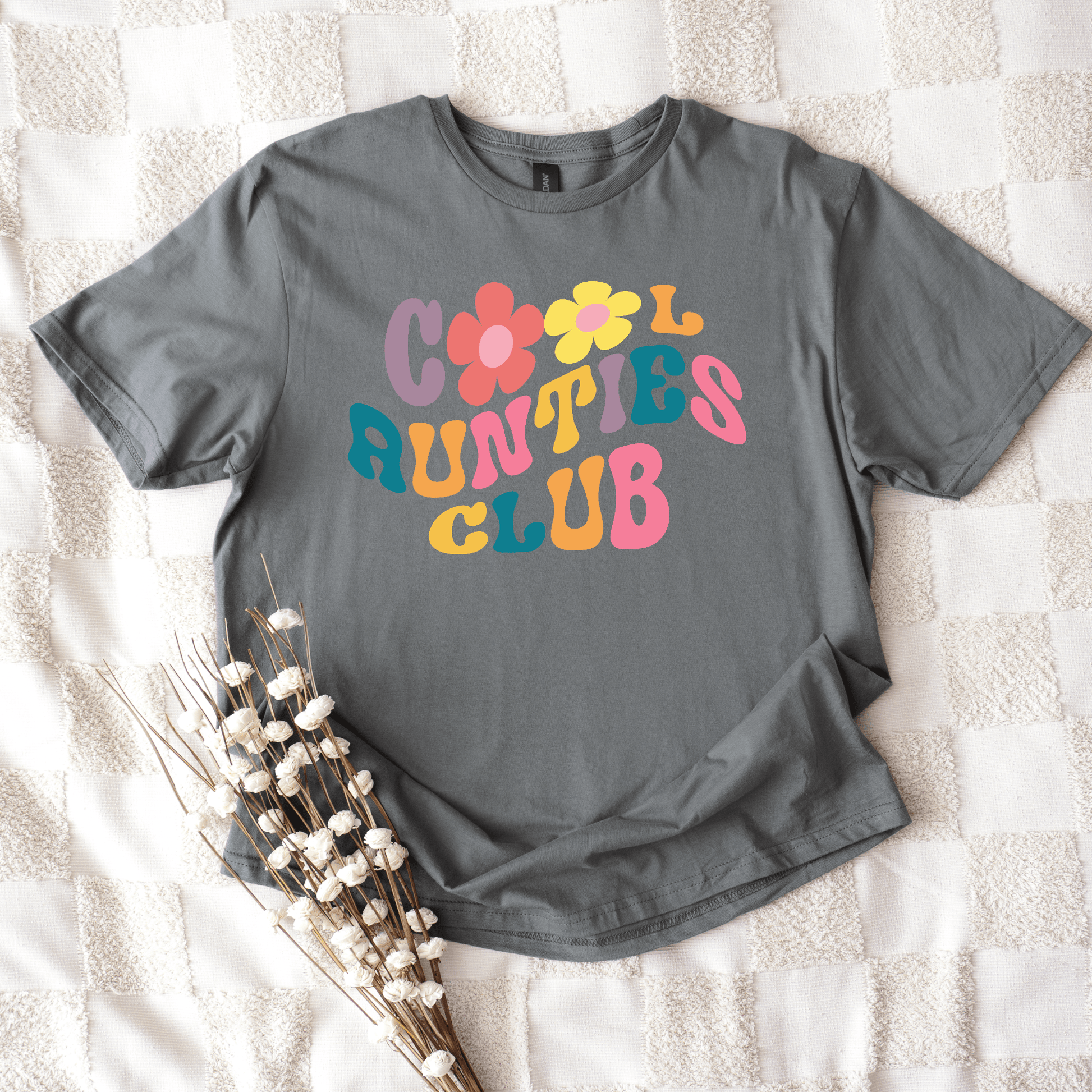 Retro Cool Aunties Club Shirt gray tee with colorful 70s style lettering and flower graphics by Maddy and George Designs