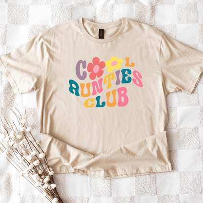 Beige cotton t shirt flatlay with colorful 70s flower lettering reading Retro Cool Aunties Club Shirt from Maddy and George
