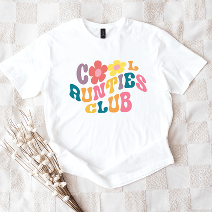 White tee displaying Retro Cool Aunties Club design with colorful 70s style lettering and floral graphics