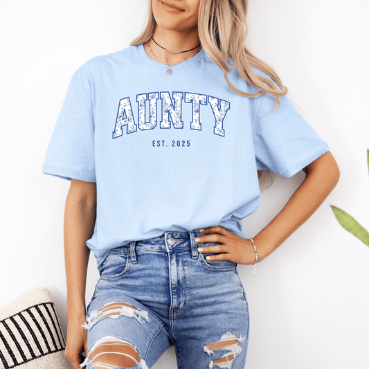 Smiling woman wearing light blue Custom Aunty Est. Year Shirt . collegiate AUNTY print with EST 2025 casual tee