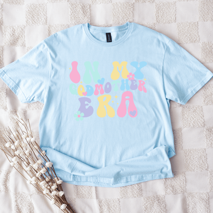 Maddy and George Designs light blue Godmother Announcement Shirt with pastel retro bubble lettering