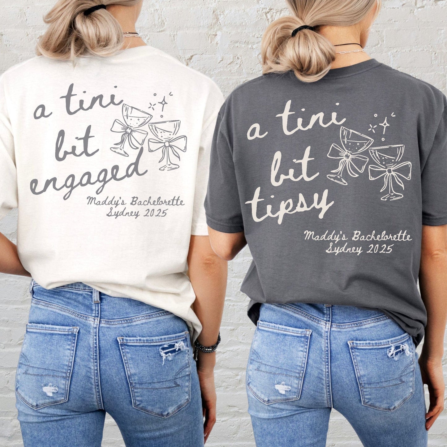 Two women from back wearing Maddy and George Designs printed tees with martini glass graphics Martini Bachelorette Shirts