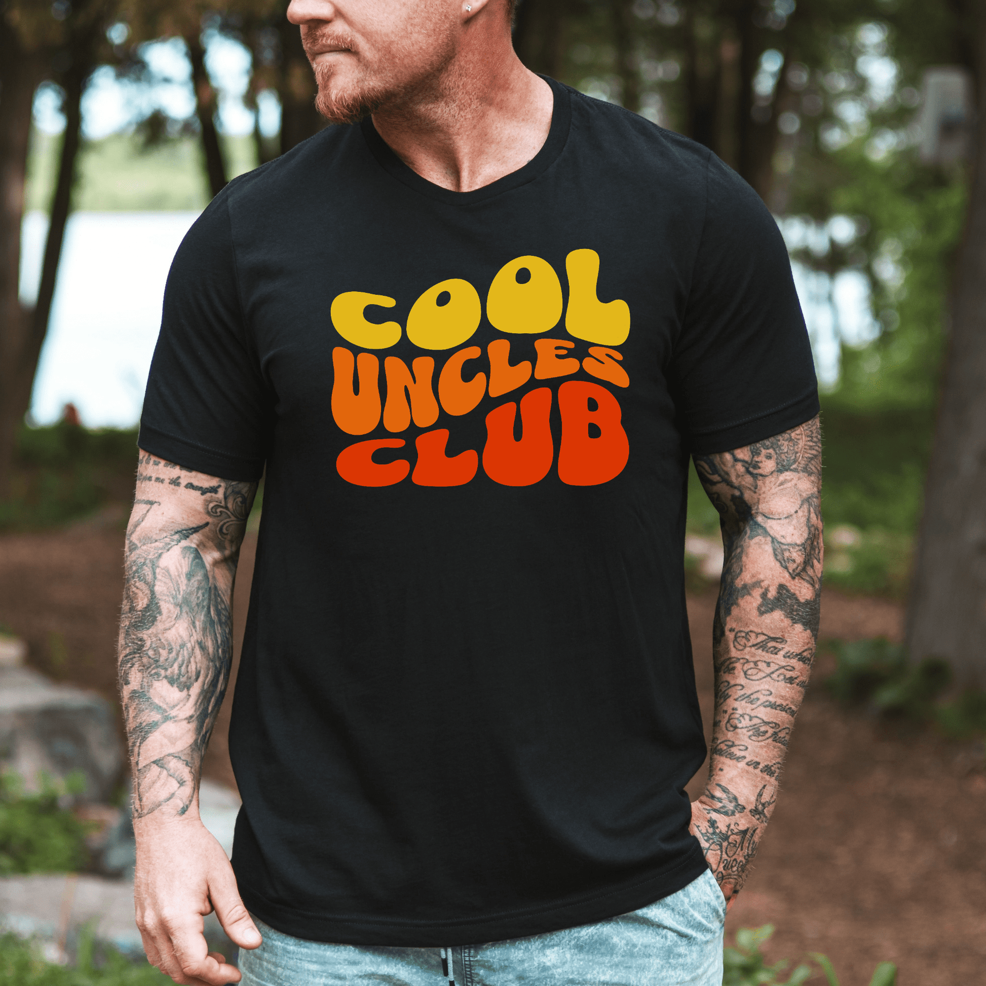 Maddy and George Designs Cool Uncles Club Shirt on black tee worn by tattooed man outdoors
